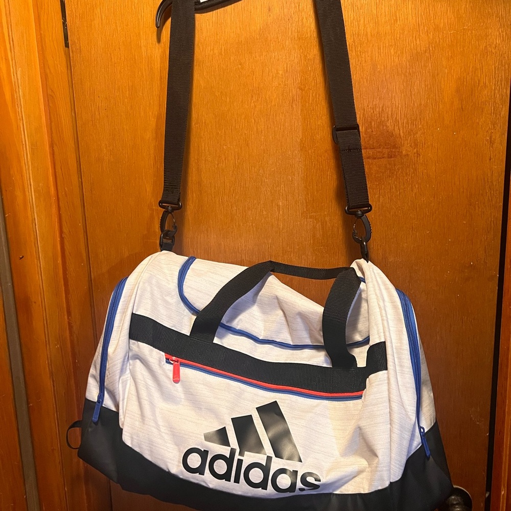 Adidas duffle bag with some discoloring on the bottom but the rest like new.